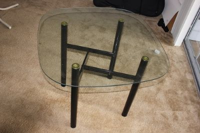 Glass table and metal tripod photo 3